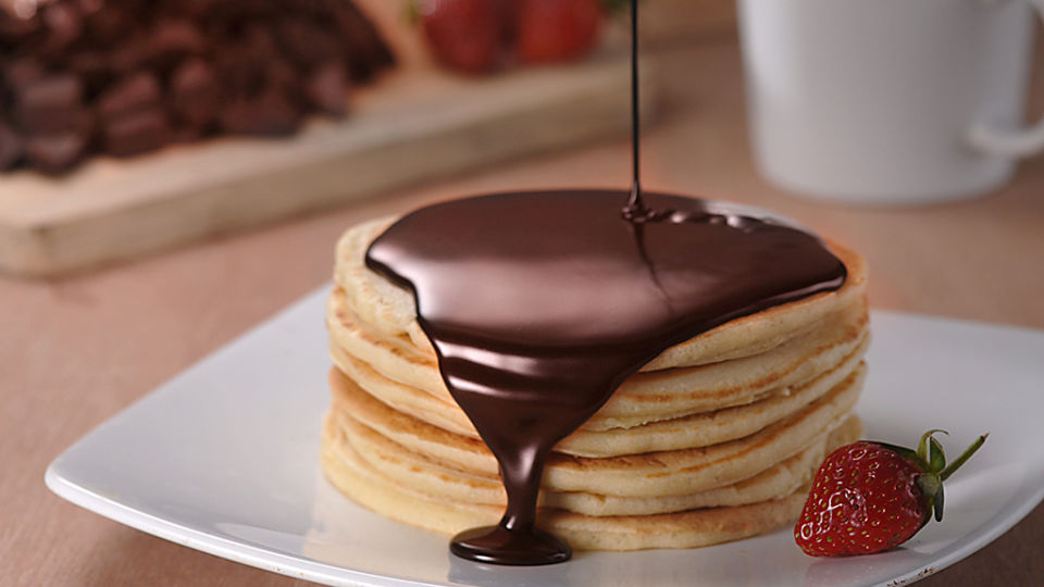 Chocolate on a stack of pancakes.